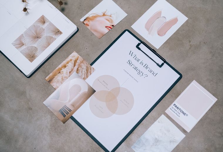 Brand identity moodboard with Pantone swatches and print samples